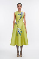 Lime green sleeveless midi dress by Tiny Ink, showcasing a fitted bodice and flowing skirt on a model.