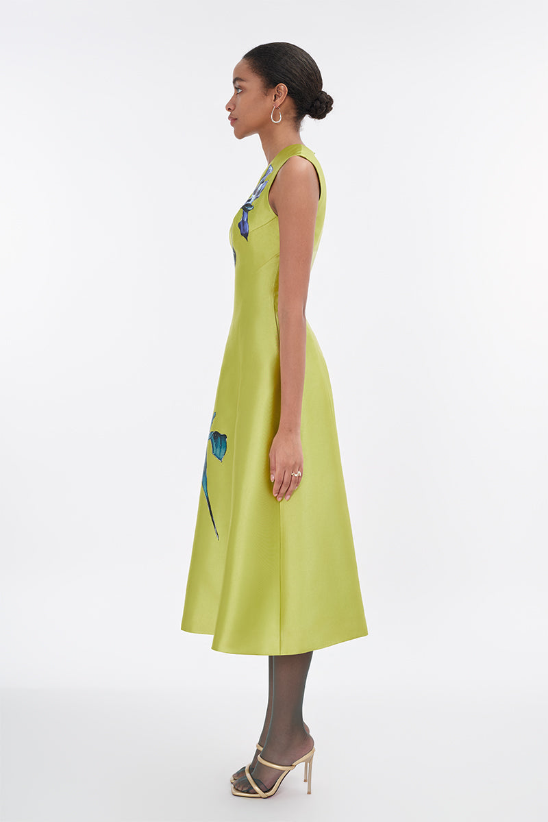 Lime green sleeveless midi dress by Tiny Ink, flowing fabric, round neckline, and midi length, displayed on a hanger.
