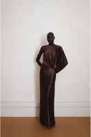 Brown Linger gown by YASSMIN SALEH, a stylish maxi dress with a flowing silhouette, shown from the front in the image.