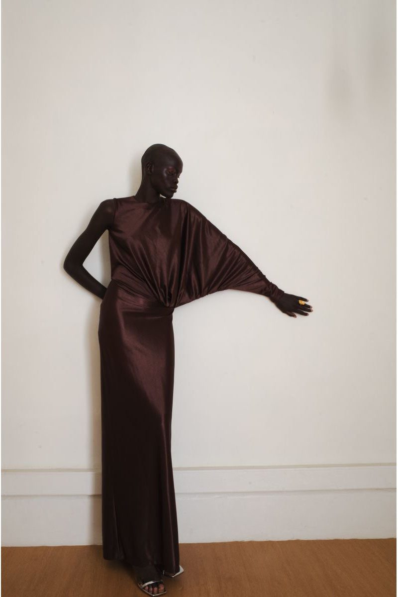 Brown Linger Gown maxi dress by YASSMIN SALEH, flowing fabric with elegant design, perfect for sophisticated occasions.