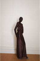 Brown Linger gown by YASSMIN SALEH, a stylish maxi dress shown from the side view with flowing fabric and elegant design.