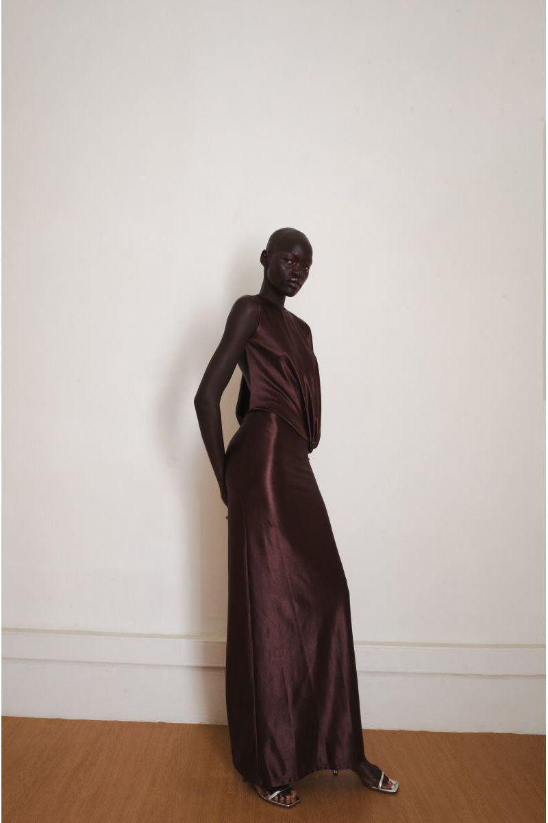 Brown Linger gown by YASSMIN SALEH, a stylish maxi dress shown from the side view with flowing fabric and elegant design.