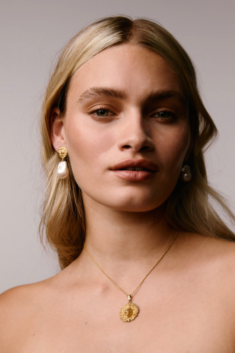 Gold Lion Pearl Drop Earrings by Freya Rose featuring elegant pearl drops and intricate lion detailing.