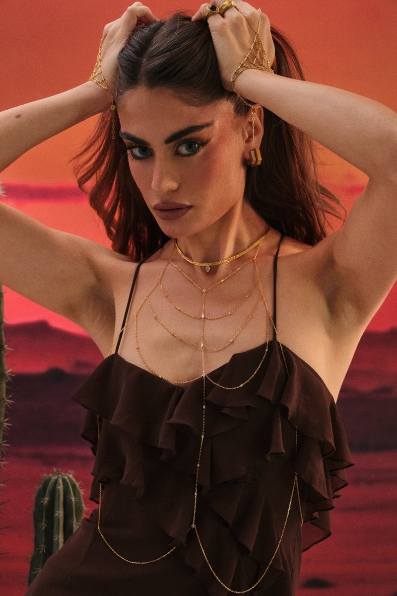 Gold Lisa body chain jewelry by Velvet Desert, featuring intricate chain design for stylish body adornment.
