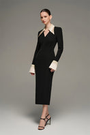 Black and beige V-neck flared cuff knee-length midi dress by I.H.F Studio with long black crepe fabric and beige wing cuff details.