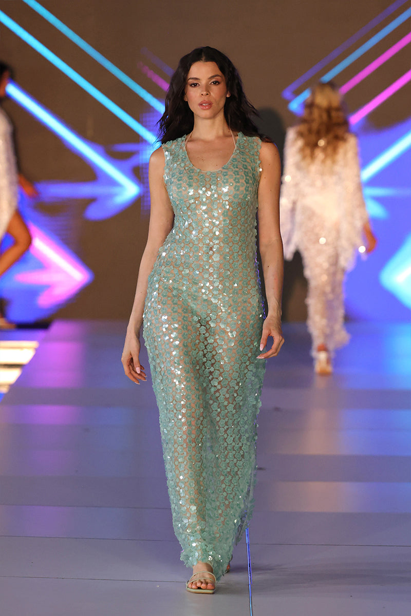 Nur Karaata Coco’s maxi dress shown in a flowing, stylish design with a vibrant pattern, perfect for elegant summer wear.