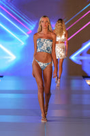 White elephant print bikini by Nur Karaata featuring a stylish, fitted swimwear design with elephant pattern details.