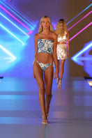 White Elephant bikini by Nur Karaata featuring a stylish bikini top and bottom with a tropical elephant print design.