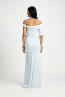 Deme By Gabriella Alba off-shoulder maxi dress in flowing fabric with a fitted bodice and elegant off-the-shoulder neckline.