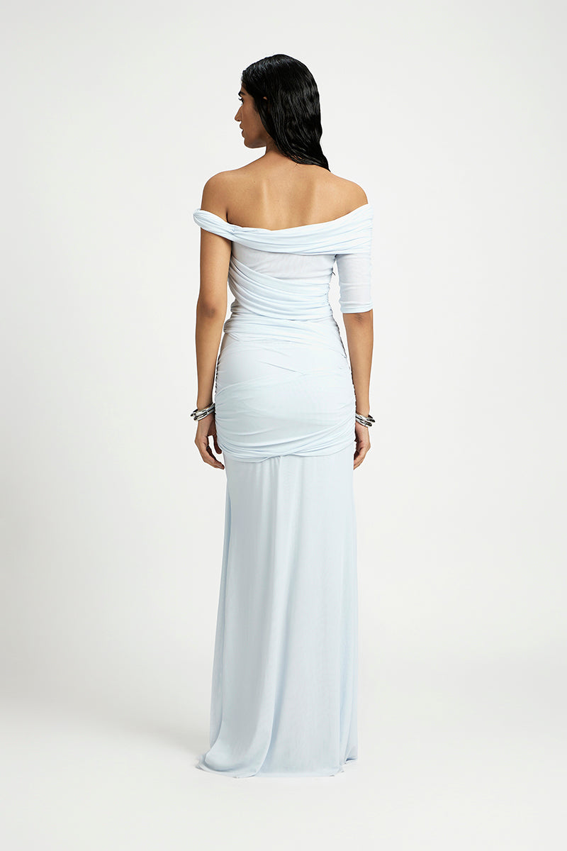 Deme By Gabriella Alba off-shoulder maxi dress in flowing fabric with a fitted bodice and elegant off-the-shoulder neckline.