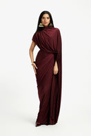 Deme By Gabriella Daphne draped maxi dress in flowing fabric, featuring elegant design and full-length silhouette.