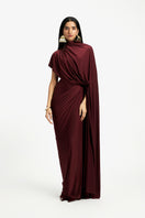 Deme by Gabriella Daphne draped maxi dress in flowing fabric, showcasing elegant design and stylish silhouette.