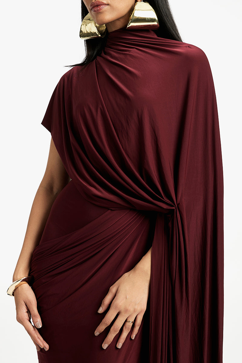 Deme By Gabriella Daphne draped maxi dress in flowy fabric with a relaxed fit and elegant draping, perfect for formal or casual occasions.