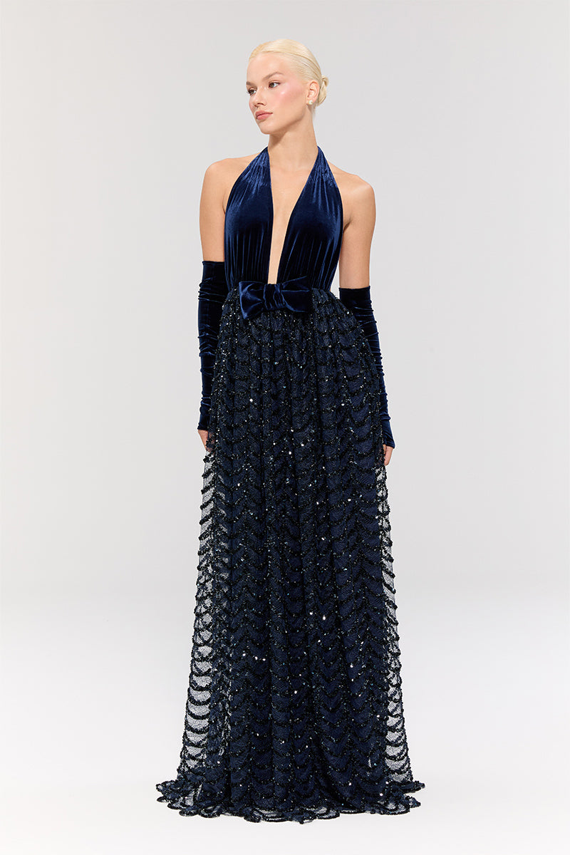 Nur Karaata crowlight gown featuring intricate lace details and flowing fabric, perfect for elegant formal occasions.
