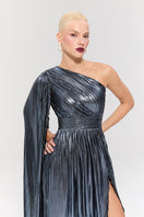 Elegant Nur Karaata Baglioni Sapphire Gown displayed on a hanger, showcasing its flowing fabric and intricate design details.