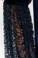 Nur Karaata Amethyst Dynasty gown featuring intricate detailing and flowing fabric, ideal for elegant formal occasions.