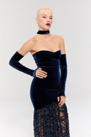 Elegant amethyst Dynasty gown by Nur Karaata featuring intricate detailing and flowing fabric, displayed on a mannequin.