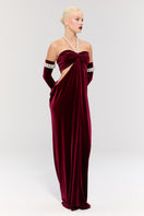Elegant royal ancestry red gown by Nur Karaata, featuring intricate details and flowing fabric, perfect for formal occasions.