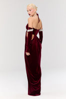 Elegant red gown by Nur Karaata from Royal Ancestry collection, featuring flowing fabric and intricate detailing, shown in Look 39.