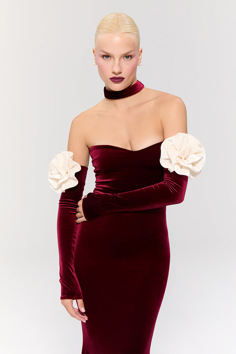 Nur Karaata Versailles Rose Burgundy Gown shown on a model, featuring elegant fabric and intricate design details.