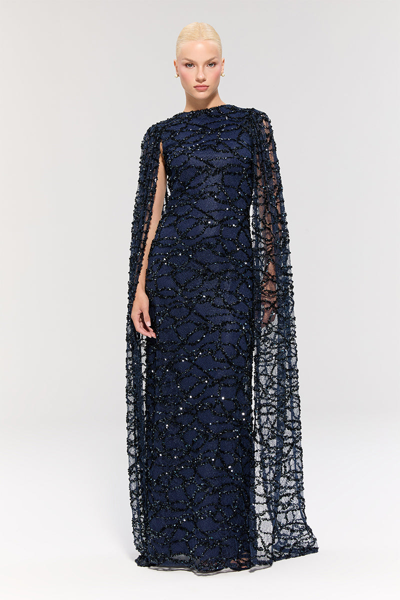 Elegant Nur Karaata Imperial Gala Gown displayed on a model, showcasing intricate design and luxurious fabric.
