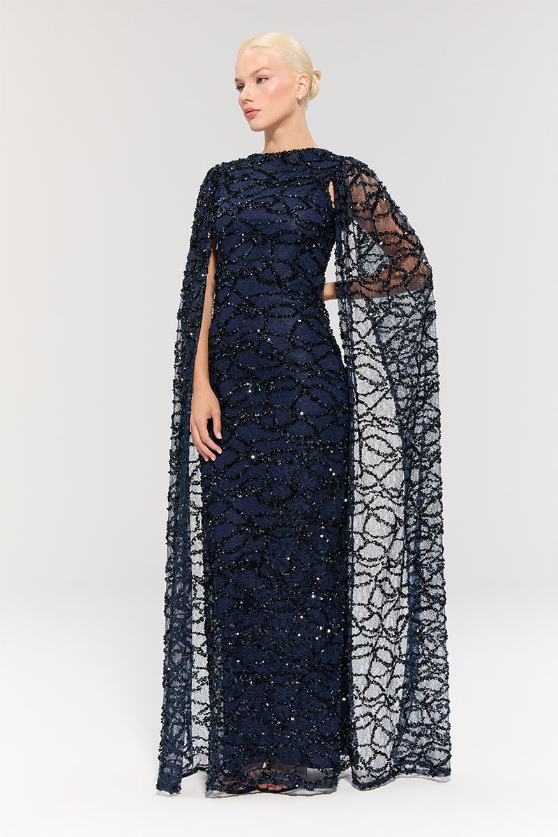 Elegant Nur Karaata Imperial Gala gown in luxurious fabric, featuring intricate design details and a flowing silhouette.
