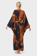 NiLuu Loren Anya oriental kimono robe shown from the back, featuring intricate patterns and flowing fabric.