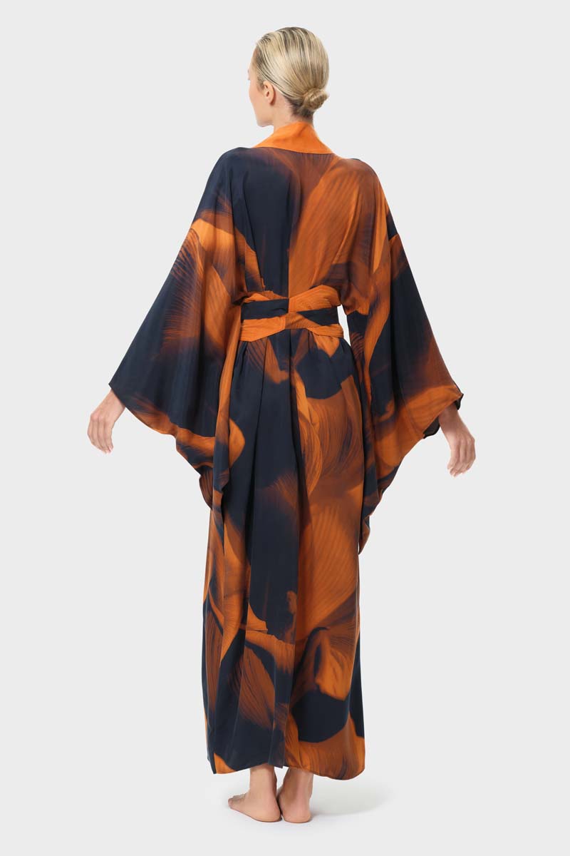 NiLuu Loren Anya oriental kimono robe shown from the back, featuring intricate patterns and flowing fabric.
