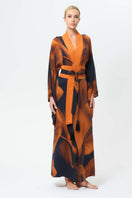 NiLuu Loren Anya oriental kimono robe displayed from the front, featuring intricate patterns and a flowing, elegant design.