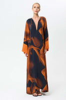 NiLuu Loren Noor kaftan dress, a stylish maxi dress with flowing fabric and intricate patterns, perfect for elegant summer wear.