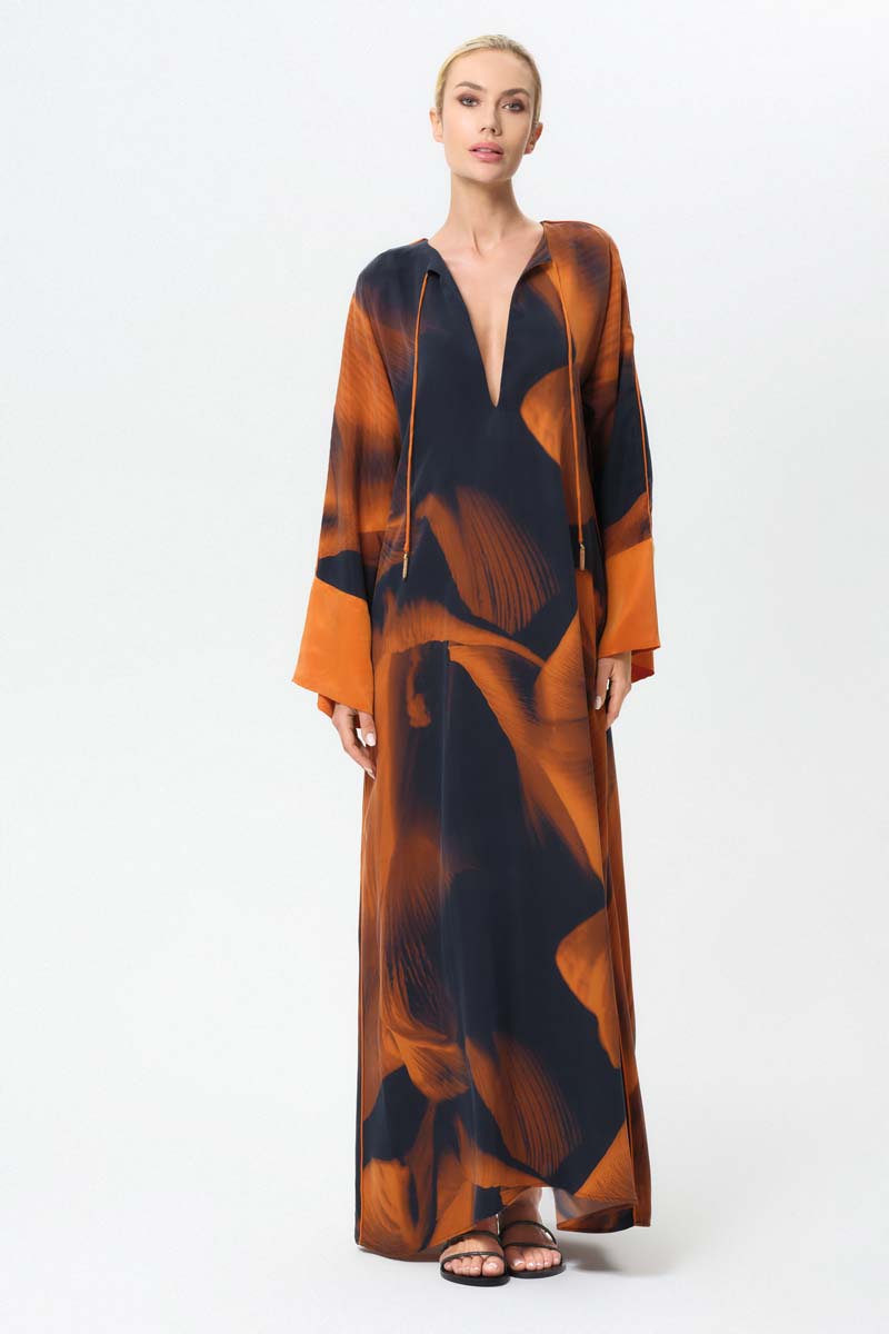 NiLuu Loren Noor kaftan dress, a stylish maxi dress with flowing fabric and intricate patterns, perfect for elegant summer wear.