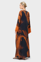 Back view of niLuu Loren Noor kaftan dress, a flowing maxi dress with intricate patterns and relaxed fit, perfect for elegant occasions.