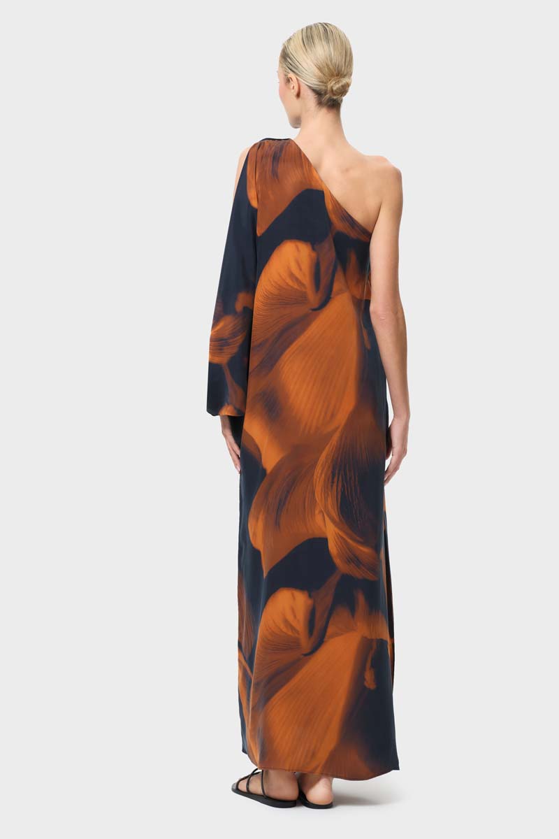 NiLuu Loren one-shoulder maxi dress shown from the back, featuring elegant draping and a stylish asymmetrical shoulder design.