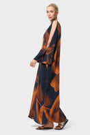 NiLuu Loren one-shoulder maxi dress displayed from the side, featuring flowing fabric and elegant design.