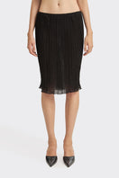Black pleated knee-length midi skirt from Stolen Stores featuring a stylish lotus pattern and elegant pleats.