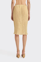 Yellow Lotus pleated knee-length midi skirt by Stolen Stores, showing the flowing fabric and pleated design.