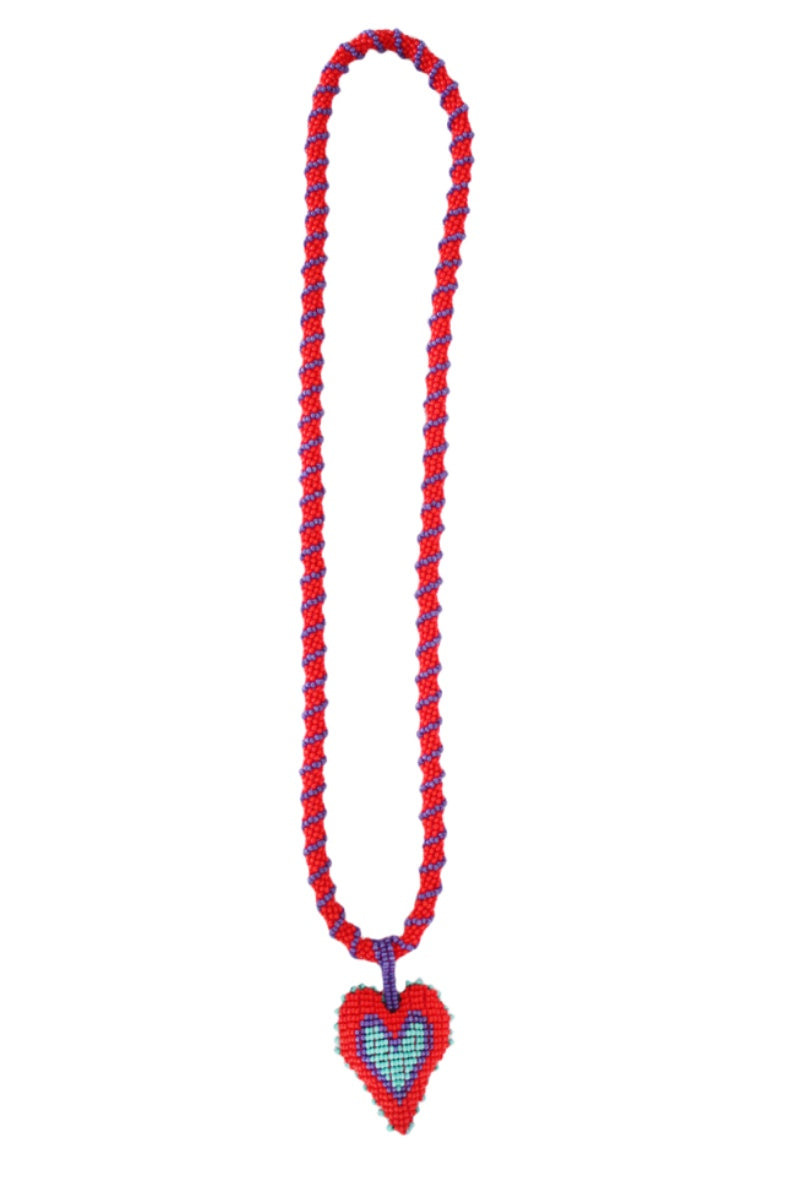 Red Love You Long Necklace by Pájara Pinta featuring a delicate chain with a heart-shaped pendant.