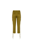Green low-rise eyelet capri pants by Tayfun Kaba, featuring a fitted style and eyelet detailing, shown on a mannequin.