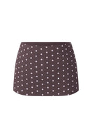 Dark brown polka dot mini skirt with a low waist, stylish and trendy, by Stolen Stores.