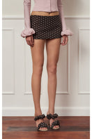 Dark brown polka dot mini skirt with a low waist, stylish and trendy, from Stolen Stores.