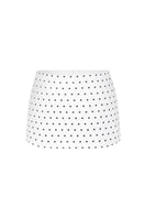 Off-white polka dot mini skirt with a low waist from Stolen Stores, shown on a model against a neutral background.