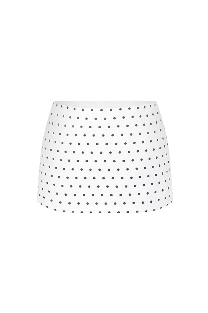 Off-white polka dot mini skirt with a low waist from Stolen Stores, shown on a model against a neutral background.