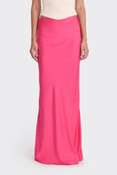 Hot pink low-waist maxi skirt from Stolen Stores, featuring a flowing design and comfortable fit.