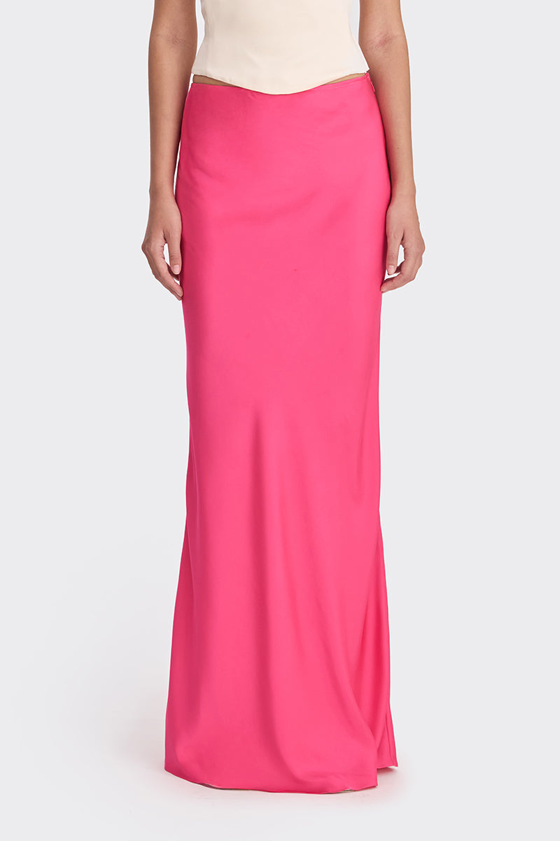 Hot pink low-waist maxi skirt from Stolen Stores, featuring a flowing design and comfortable fit.
