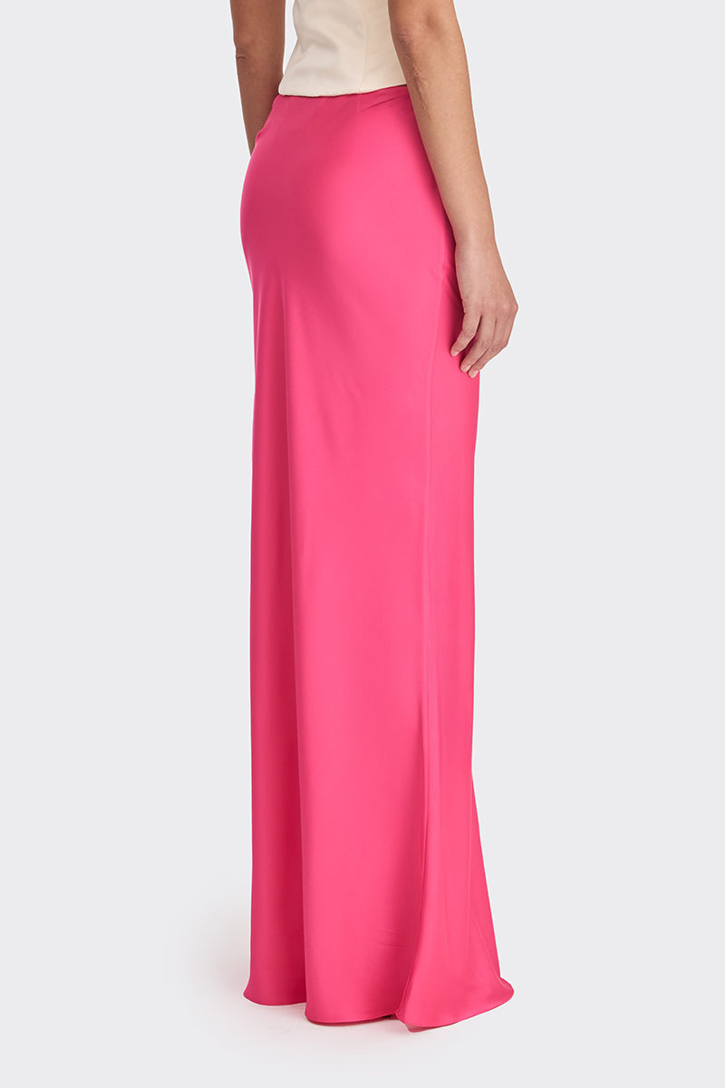 Hot pink low waist maxi skirt from Stolen Stores, featuring a flowing, stylish design perfect for casual or dressy occasions.