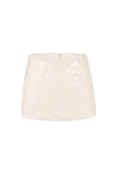 Beige low waist clear sequin mini skirt from Stolen Stores, showcasing shiny sequins and a sleek, fitted silhouette.