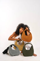 Mara Brazil Lua Bag shoulder bag in vibrant color with sleek design, featuring a top handle and adjustable strap.