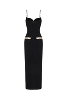 Black Luciana maxi dress by Nana Jacqueline with ring cutout detail, shown from the back on a model.