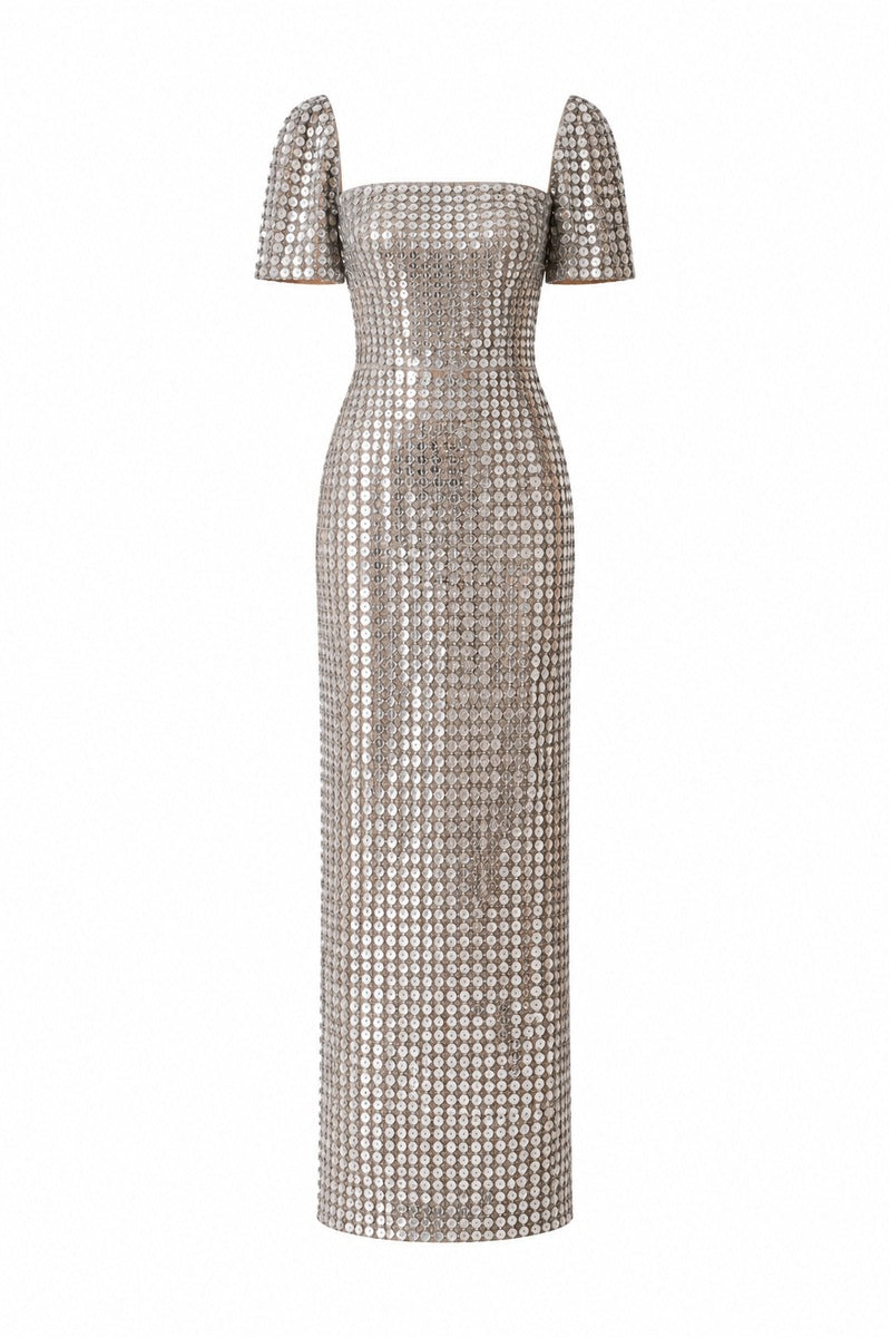 Silver Lujain sequin gown by Nihan Peker featuring intricate sequin detailing and a flowing elegant design.