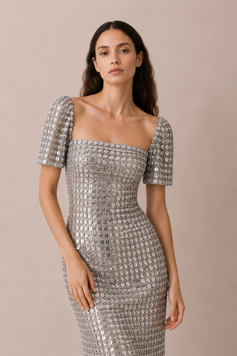 Silver Lujain sequin gown by Nihan Peker, featuring shimmering sequins and elegant design, perfect for formal occasions.